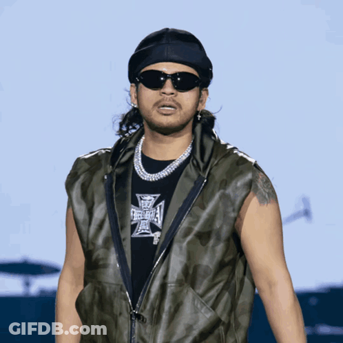 A Man Wearing Sunglasses And A Black Shirt That Says Freeway On It GIF