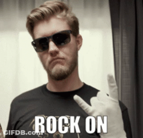 A Man Wearing Sunglasses And A Black Shirt With The Word Rock On On It GIF