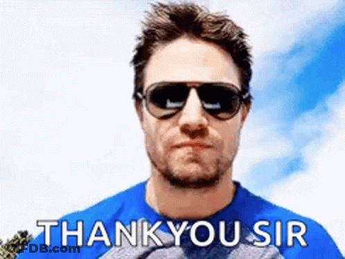 A Man Wearing Sunglasses And A Blue Shirt Is Giving A Thank You Sir Sign . GIF