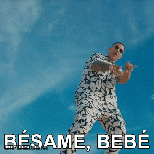 A Man Wearing Sunglasses And A Blue Shirt Says Besame Bebe In Spanish GIF