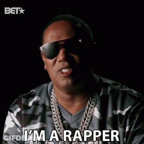 A Man Wearing Sunglasses And A Camo Shirt Is Saying I 'M A Rapper GIF