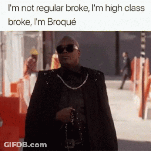 A Man Wearing Sunglasses And A Cape Is Walking Down A Street With The Caption I 'M Not Regular Broke GIF
