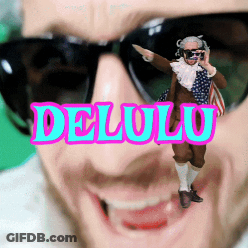 A Man Wearing Sunglasses And A Costume With The Word Delolo On It GIF
