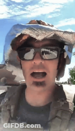 A Man Wearing Sunglasses And A Cowboy Hat Is Talking GIF