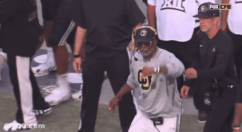 A Man Wearing Sunglasses And A Fox Cbs Hat GIF