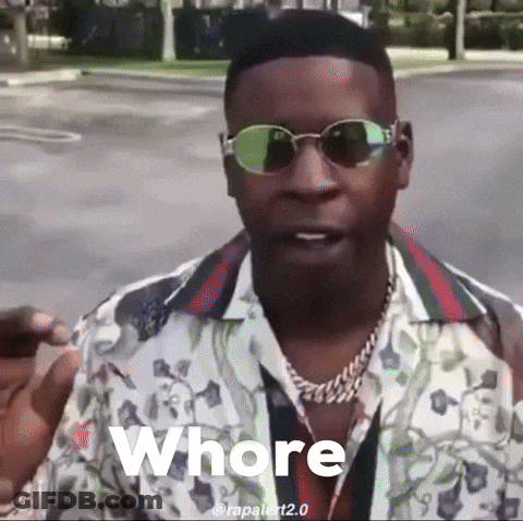 A Man Wearing Sunglasses And A Gucci Shirt Says Whore GIF