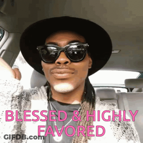A Man Wearing Sunglasses And A Hat Is Sitting In A Car With The Words Blessed And Highly Favored Written Above Him GIF