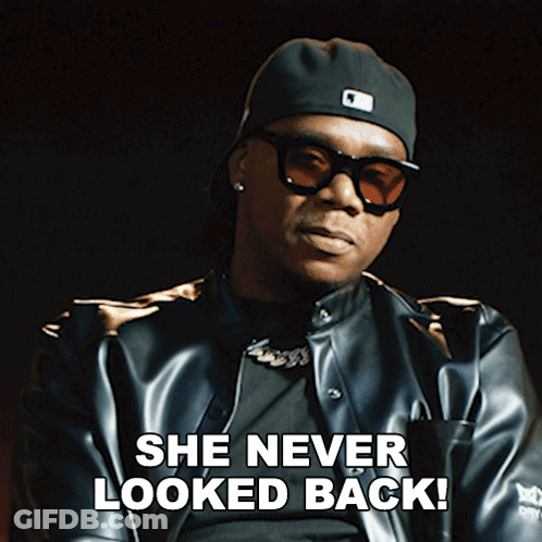 A Man Wearing Sunglasses And A Hat Says " She Never Looked Back " GIF