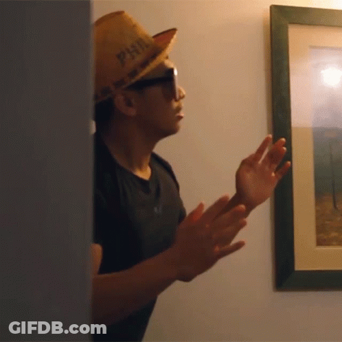 A Man Wearing Sunglasses And A Hat That Says Phil On It GIF