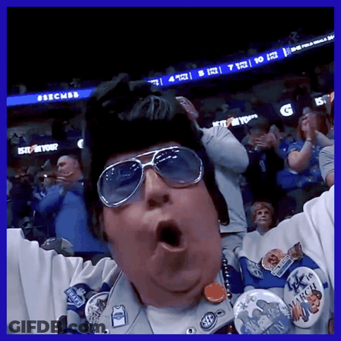 A Man Wearing Sunglasses And A Hat With A Badge That Says March On It GIF