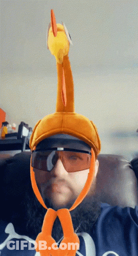 A Man Wearing Sunglasses And A Hat With A Turkey On It GIF