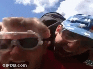 A Man Wearing Sunglasses And A Hat With Stars On It Looks At The Camera GIF