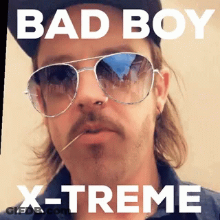 A Man Wearing Sunglasses And A Hat With The Words Bad Boy X-Treme GIF