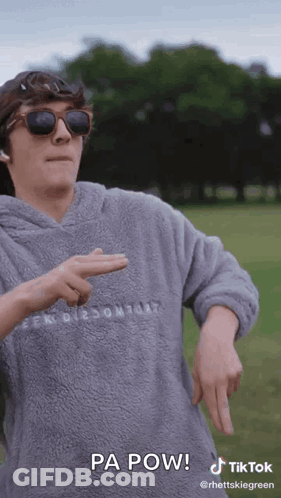 A Man Wearing Sunglasses And A Hoodie Says Pa Pow On A Tiktok Video . GIF