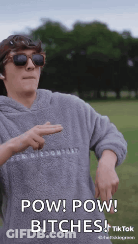 A Man Wearing Sunglasses And A Hoodie Says Pow Pow Bitches On A Tiktok Video . GIF