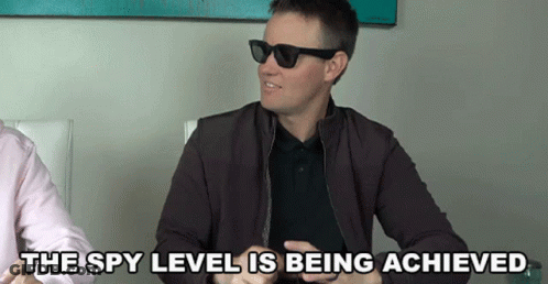 A Man Wearing Sunglasses And A Jacket Says " The Spy Level Is Being Achieved " GIF