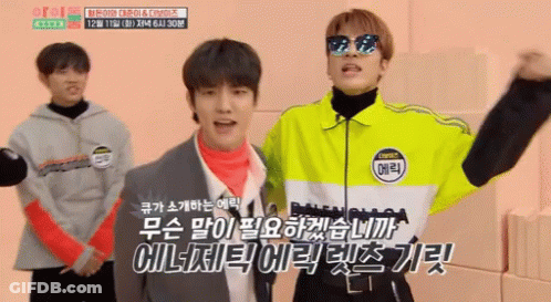 A Man Wearing Sunglasses And A Jacket That Says ' Balenciaga ' On It Stands Next To Another Man In A Suit GIF