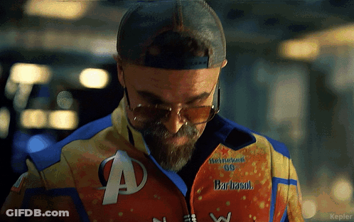 Man Wearing Sunglasses And Barbasol Jacket GIF
