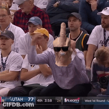 A Man Wearing Sunglasses And A Mask Giving The Middle Finger At A Basketball Game GIF