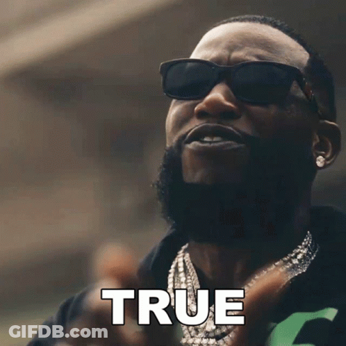 A Man Wearing Sunglasses And A Necklace Has The Word True Above Him GIF
