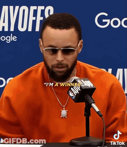 A Man Wearing Sunglasses And A Necklace Says " I 'M A Winner " In Front Of A Nba Microphone GIF