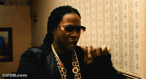 A Man Wearing Sunglasses And A Necklace That Says Pop GIF