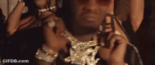 Man Wearing Sunglasses And Diamond Necklace Holding Key GIF
