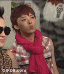 A Man Wearing Sunglasses And A Pink Scarf Has The Name Oxxcherryz On The Bottom GIF