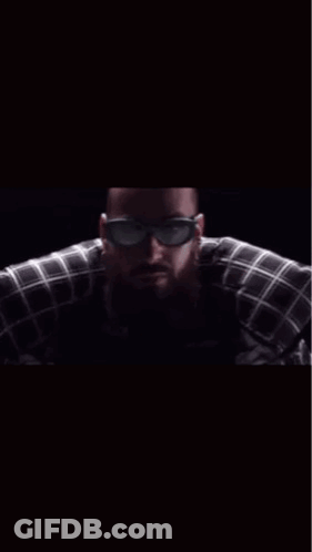 A Man Wearing Sunglasses And A Plaid Shirt With The Words Hey Le Brother On The Bottom GIF