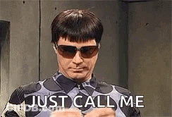 A Man Wearing Sunglasses And A Polka Dot Shirt Is Holding His Hands Together And Says `` Just Call Me '' . GIF