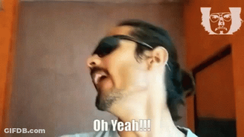 A Man Wearing Sunglasses And A Ponytail Is Saying Oh Yeah !!! GIF