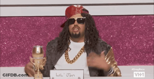 A Man Wearing Sunglasses And A Red Bandana Is Holding A Trophy And A Sign That Says Lil Jon GIF