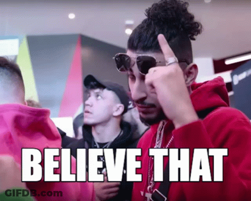 A Man Wearing Sunglasses And A Red Hoodie With The Words " Believe That " On The Bottom GIF