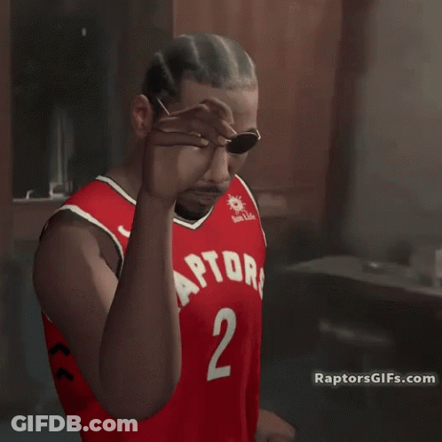A Man Wearing Sunglasses And A Red Jersey With The Number 2 On It GIF