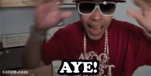 A Man Wearing Sunglasses And A Red Shirt Says Aye . GIF