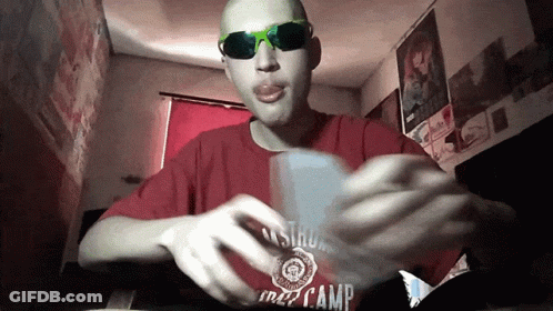 A Man Wearing Sunglasses And A Red Shirt That Says Camp On It GIF