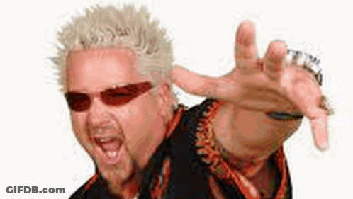 A Man Wearing Sunglasses And A Ring Is Making A Funny Face With His Hand Outstretched . GIF