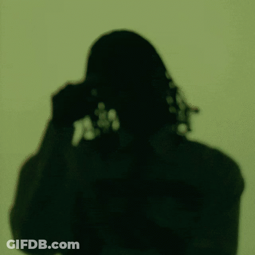 A Man Wearing Sunglasses And A Shirt That Says ' A ' On It GIF