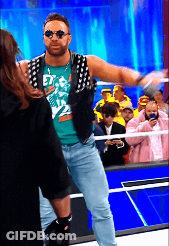 A Man Wearing Sunglasses And A Shirt That Says " Et " On It GIF