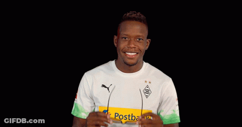 A Man Wearing Sunglasses And A Shirt That Says Postbank On It GIF