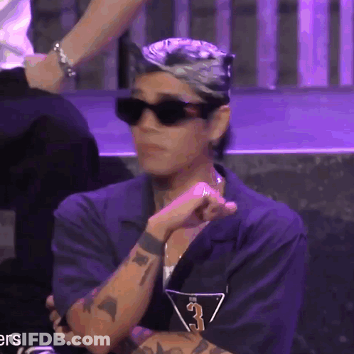 A Man Wearing Sunglasses And A Shirt With The Number 3 GIF