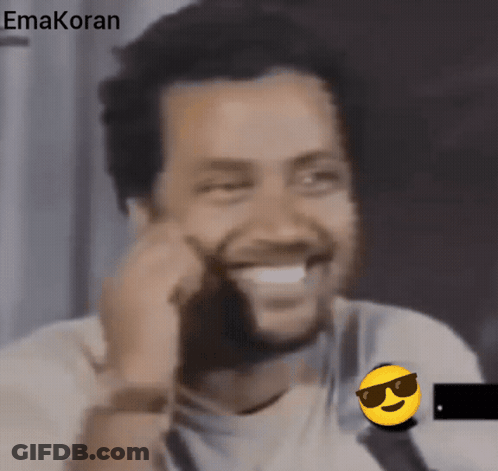 A Man Wearing Sunglasses And A Smiley Face With The Word Emakoran On The Bottom Right GIF