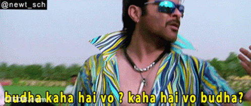 A Man Wearing Sunglasses And A Striped Shirt Says Buddha Kaha Hai Vo Kaha Hai Vo Buddha GIF