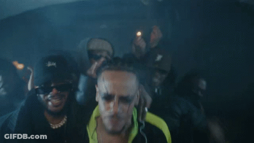 A Man Wearing Sunglasses And A Stussy Hat GIF