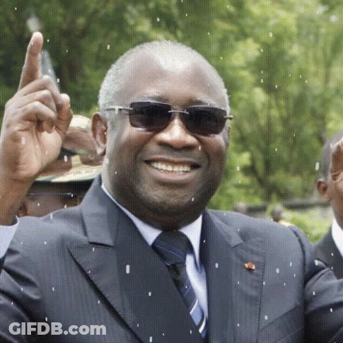 A Man Wearing Sunglasses And A Suit Is Smiling And Giving A Thumbs Up GIF