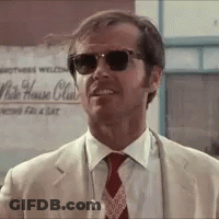 A Man Wearing Sunglasses And A Suit Is Standing In Front Of A Sign That Says White House Club GIF