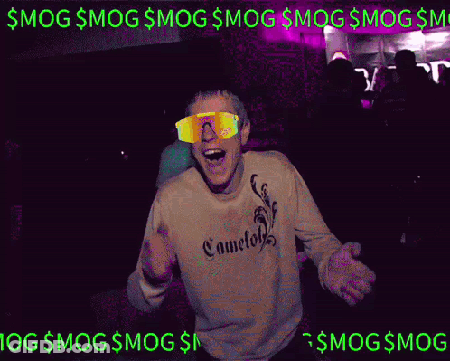 A Man Wearing Sunglasses And A Sweatshirt Is Dancing In A Club GIF