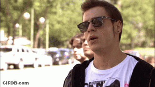 A Man Wearing Sunglasses And A T-Shirt That Says " A Tres Dias " On It GIF