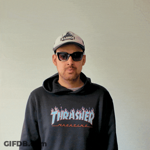 A Man Wearing Sunglasses And A Thrasher Magazine Sweatshirt GIF