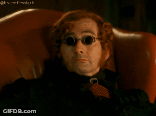 A Man Wearing Sunglasses And A Tie Is Sitting In A Chair And Says He 'S Got A Point GIF